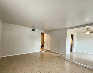 7610 W Powhatan Avenue - Photo Thumbnail 1