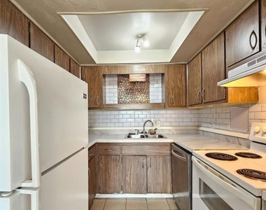 7610 W Powhatan Avenue - Photo Thumbnail 4