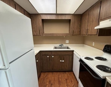 7610 W Powhatan Avenue - Photo Thumbnail 3