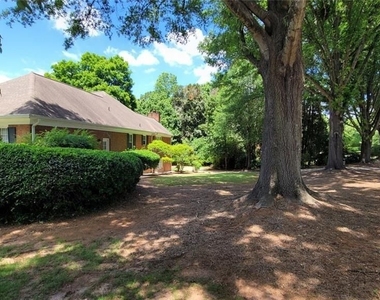 5005 Johns Creek Court - Photo Thumbnail 1