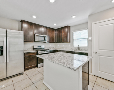 8047 W Albeniz Place - Photo Thumbnail 4