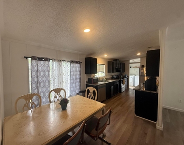 10548 Sw Sandalfoot Boulevard - Photo Thumbnail 1