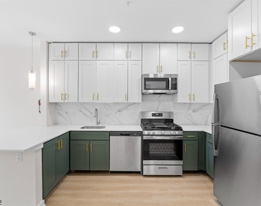321 E 3rd St - Photo Thumbnail 23