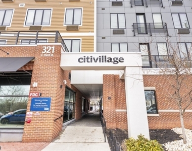 321 E 3rd St - Photo Thumbnail 2