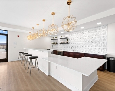 321 E 3rd St - Photo Thumbnail 33