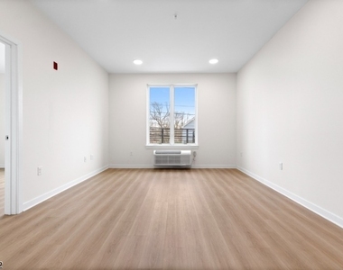 321 E 3rd St - Photo Thumbnail 12