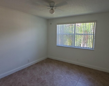 8721 Wiles Road - Photo Thumbnail 4