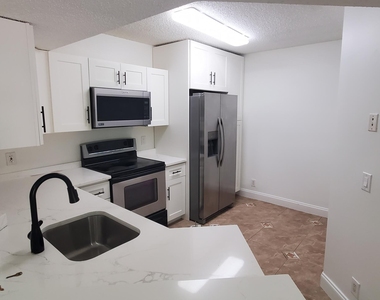 8721 Wiles Road - Photo Thumbnail 2