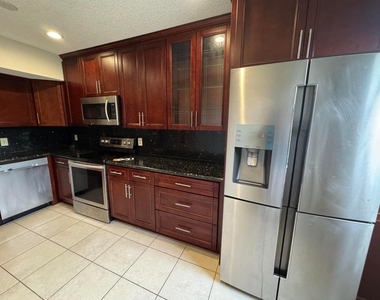 8781 Wiles Road - Photo Thumbnail 3