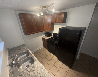 2000 W Jarvis Avenue - Photo Thumbnail 4