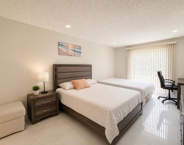 8310 Sands Point Boulevard - Photo Thumbnail 2