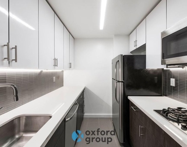 E 33rd St. - Photo Thumbnail 5