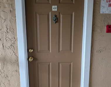 7667 N Wickham Road - Photo Thumbnail 1