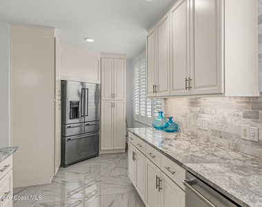 7415 Aquarina Beach Drive - Photo Thumbnail 19