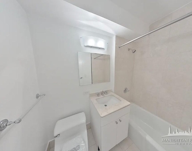 W 48th St - Photo Thumbnail 5
