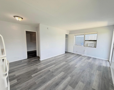 113 E 27th Street - Photo Thumbnail 3