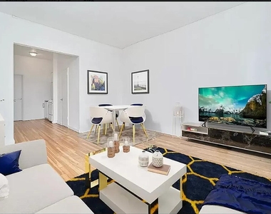 353 W 44th Street - Photo Thumbnail 2
