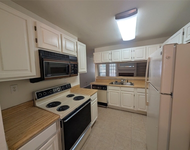 5981 Arapaho Road - Photo Thumbnail 4