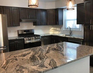 115 Burnside Ave - Photo Thumbnail 1