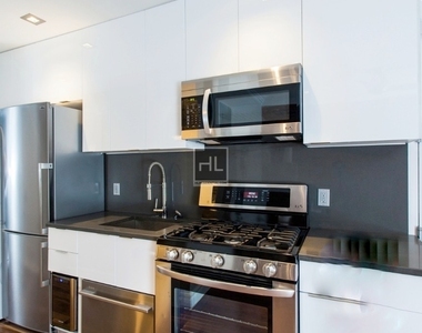 E 26th St. - Photo Thumbnail 5