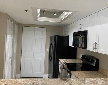 5061 Wiles Road - Photo Thumbnail 1