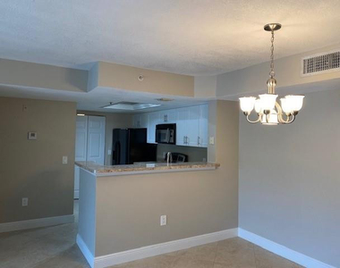 5061 Wiles Road - Photo Thumbnail 2