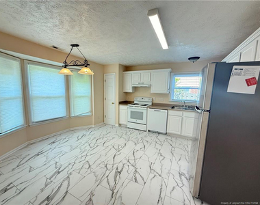 7229 Tollhouse Drive - Photo Thumbnail 2