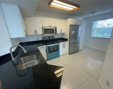 9033 Wiles Road - Photo Thumbnail 2