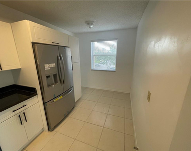 9033 Wiles Road - Photo Thumbnail 5