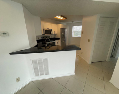 9033 Wiles Road - Photo Thumbnail 4