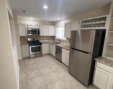 7402 Wood Bluff Boulevard - Photo Thumbnail 2