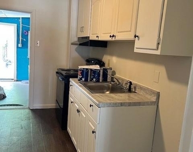 100 E 6th Street - Photo Thumbnail 1