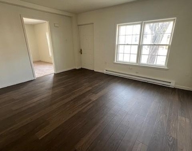 100 E 6th Street - Photo Thumbnail 3