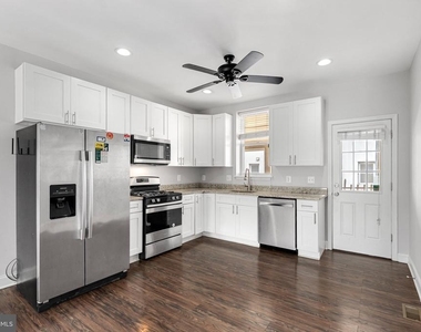 539 W 27th Street W - Photo Thumbnail 8