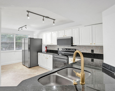 8761 Wiles Road - Photo Thumbnail 2