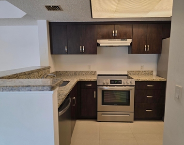 5055 Wiles Road - Photo Thumbnail 3