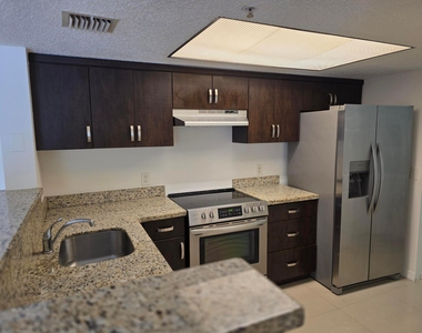 5055 Wiles Road - Photo Thumbnail 2