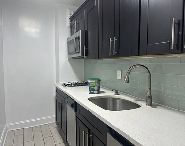86-11 Whitney Avenue - Photo Thumbnail 3