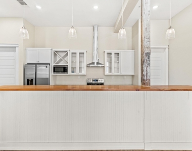 104 E 2nd St - Photo Thumbnail 11