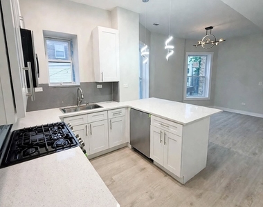 6039 S Eberhart Avenue - Photo Thumbnail 2