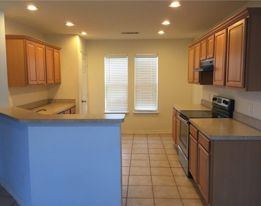 6908 Planters Row Drive - Photo Thumbnail 3
