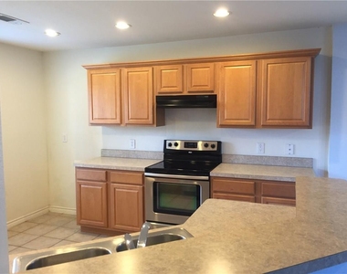 6908 Planters Row Drive - Photo Thumbnail 2