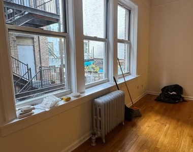 W 13th St - Photo Thumbnail 2