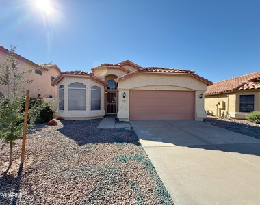 9765 W Yukon Drive - Photo Thumbnail 1