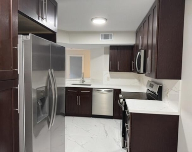 8801 Wiles Road - Photo Thumbnail 1