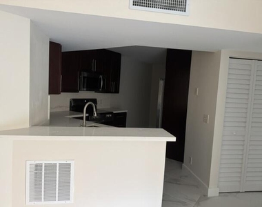 8801 Wiles Road - Photo Thumbnail 4