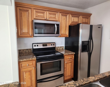 7667 N Wickham Road - Photo Thumbnail 4