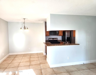 7667 N Wickham Road - Photo Thumbnail 6