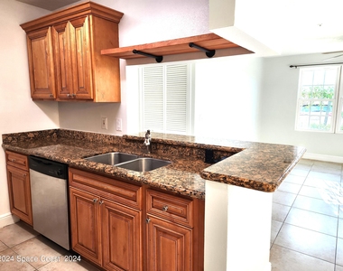 7667 N Wickham Road - Photo Thumbnail 5