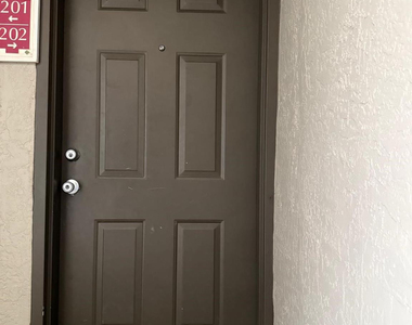 5061 Wiles Road - Photo Thumbnail 3